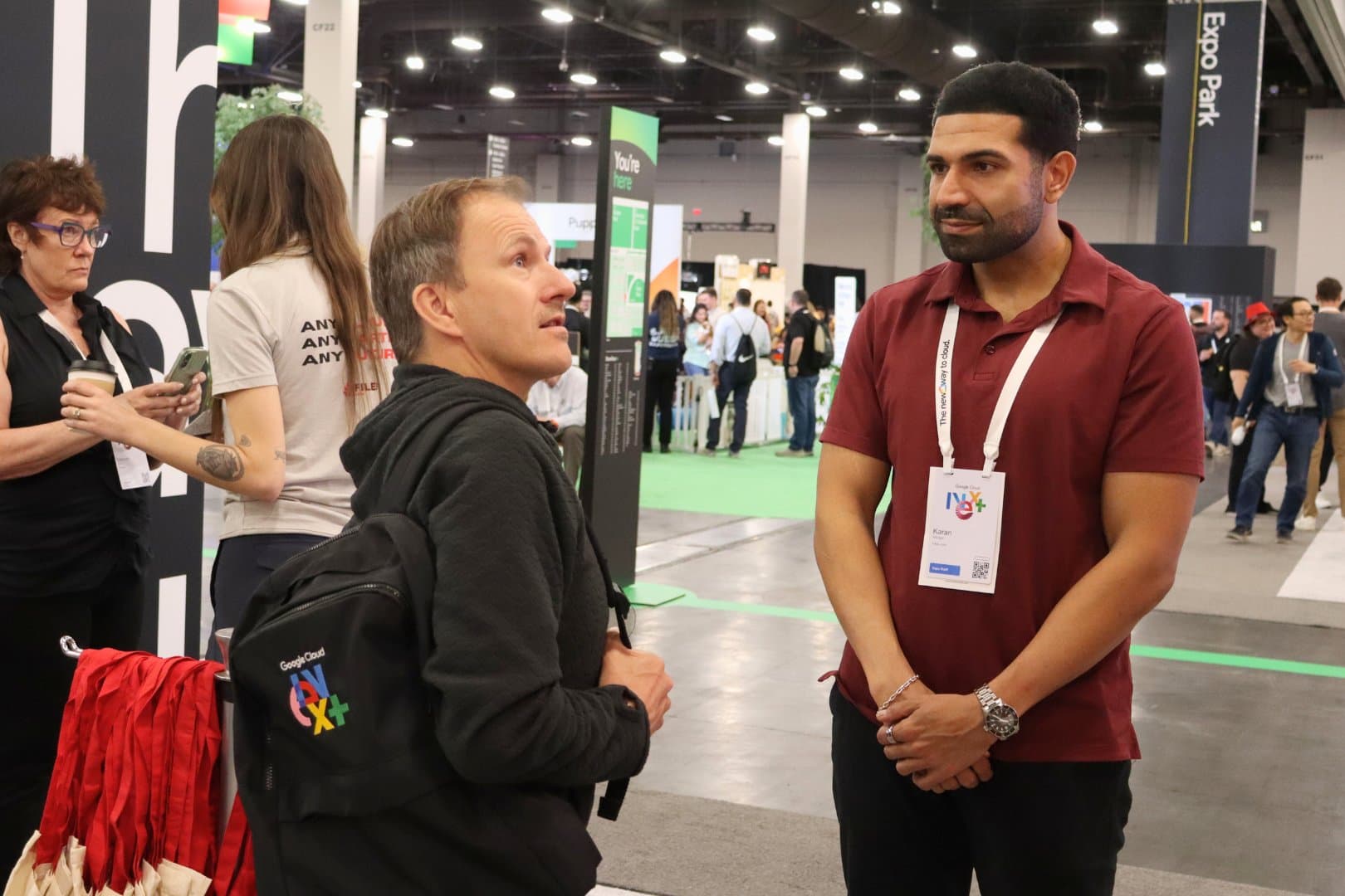 A Files.com team member talking with an attendee at Google Cloud Next