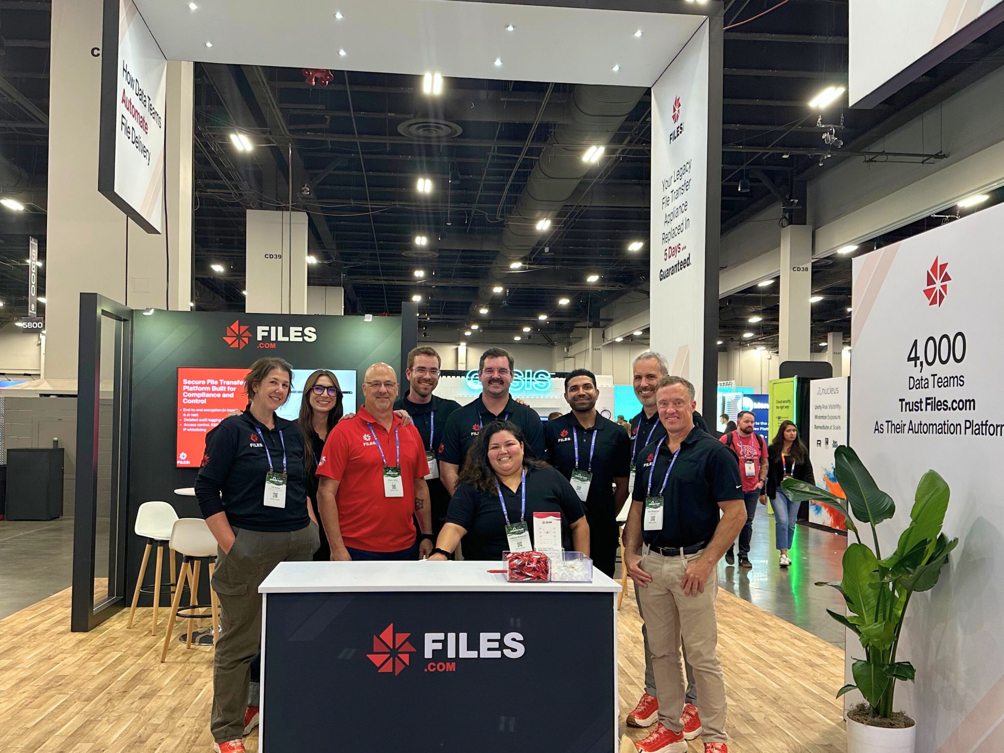 The Files.com Enterprise Sales team posed at the booth during an industry conference in Las Vegas.